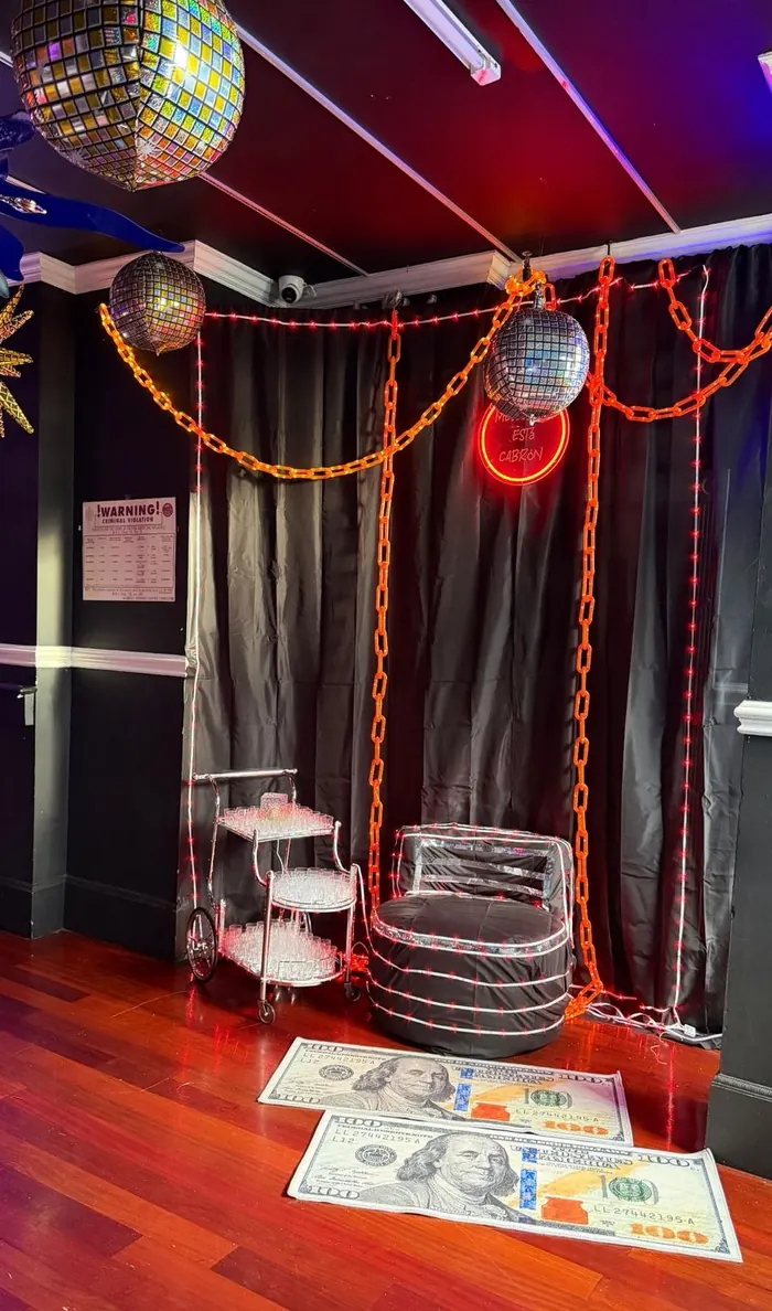 VIP corner seating with a drinks cart and disco ball